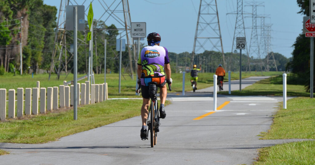 man bicycling along the Pinellas Trail in Palm Harbor