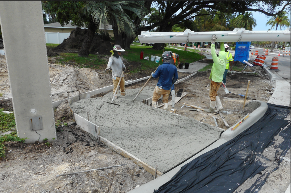Workers build new sidewalk on Mehlenbacher Road.